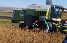 O combină agricolă a luat foc în timp ce recolta soia - FOTO